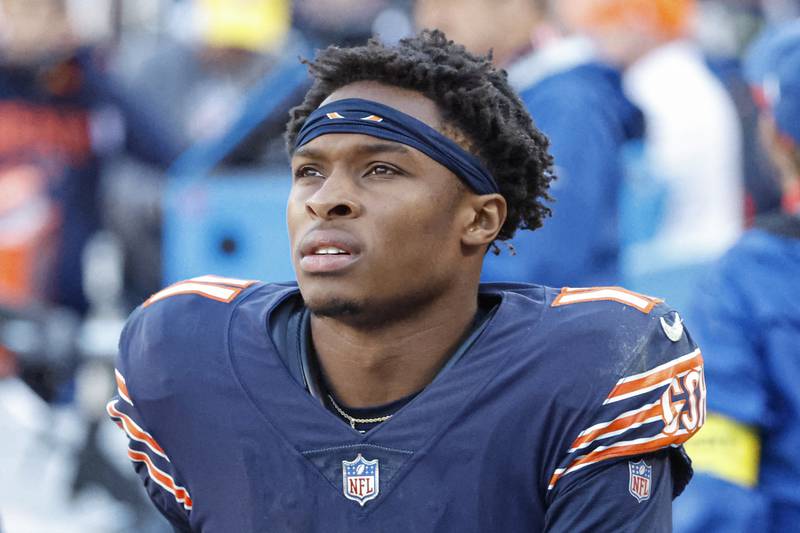 Chicago Bears wide receiver Darnell Mooney (11) sits on the sidelines during the second half of an NFL football game against the Miami Dolphins, Sunday, Nov. 6, 2022, in Chicago. (AP Photo/Kamil Krzaczynski)