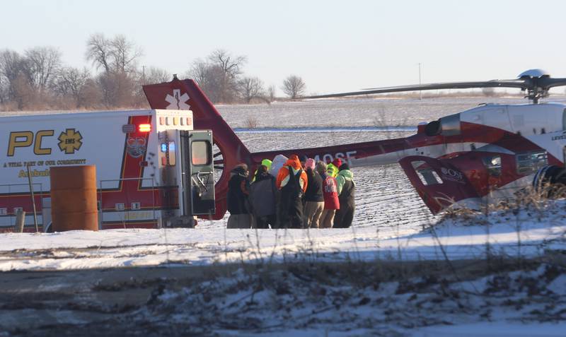Putnam County EMS transfer a victim to OSF lifeflight helicopter who was involved in a grain bin incident on Monday, Jan. 26, 2026 in the 13000 block of North 950th Avenue just south of Granville. Two lifeflight helicopters landed and one victim was flown from the scene.