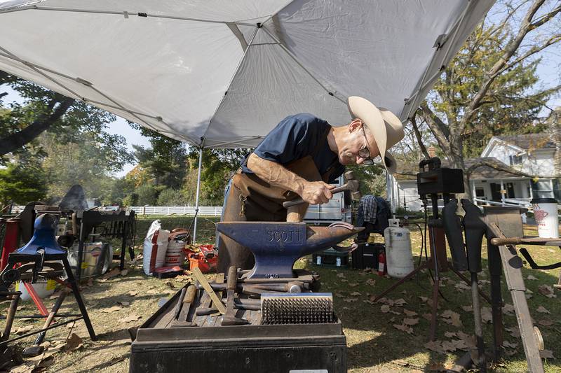 Dan Tesar of Prairie Du Chien, Wis. fine tunes a horse shoe Saturday, October. 12, 2024, at the John Deere Historic Site’s Fall Fest.