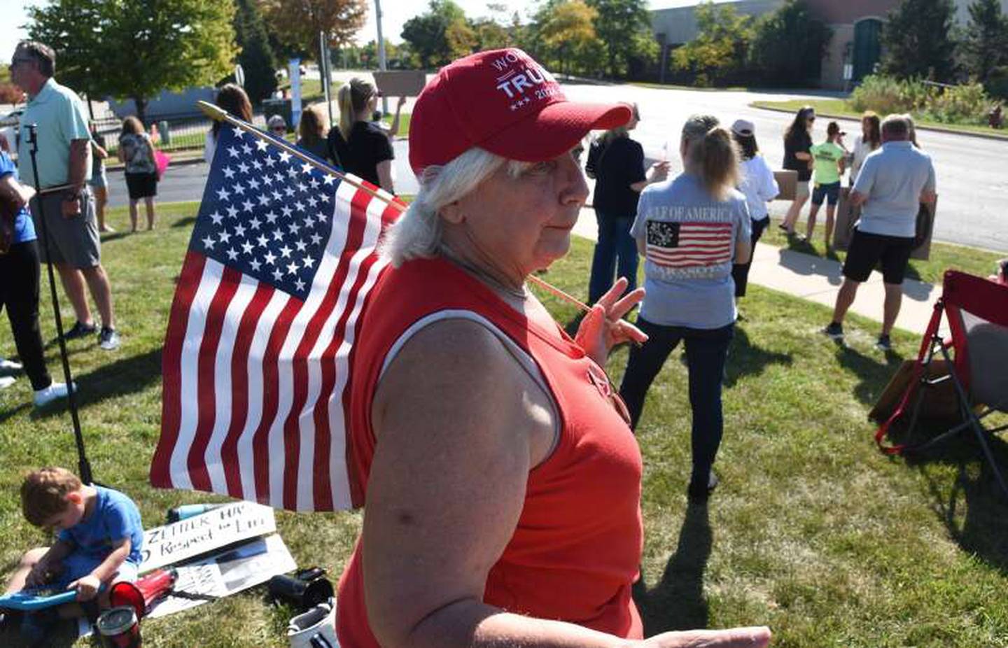 About 60 people participated in a protest on Monday, Sept. 15, 2025, at District 300 headquarters in Algonquin, demanding that school board president Nancy Zettler step down following a social media post related to the shooting death of activist Charlie Kirk.