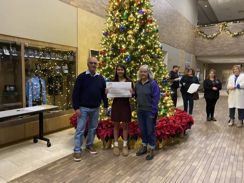 Evelyn E. donates $500 to Just Animals of Mazon as a second place finisher in the Community Foundation of Grundy County's essay contest.