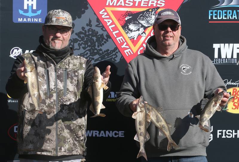 Tony Larson of Waukasha Wis. and Dave Hall of Peru, hold up their catch during the National Walleye Tour Masters Walleye Circuit on Saturday, March 23, 2024 in Spring Valley.
