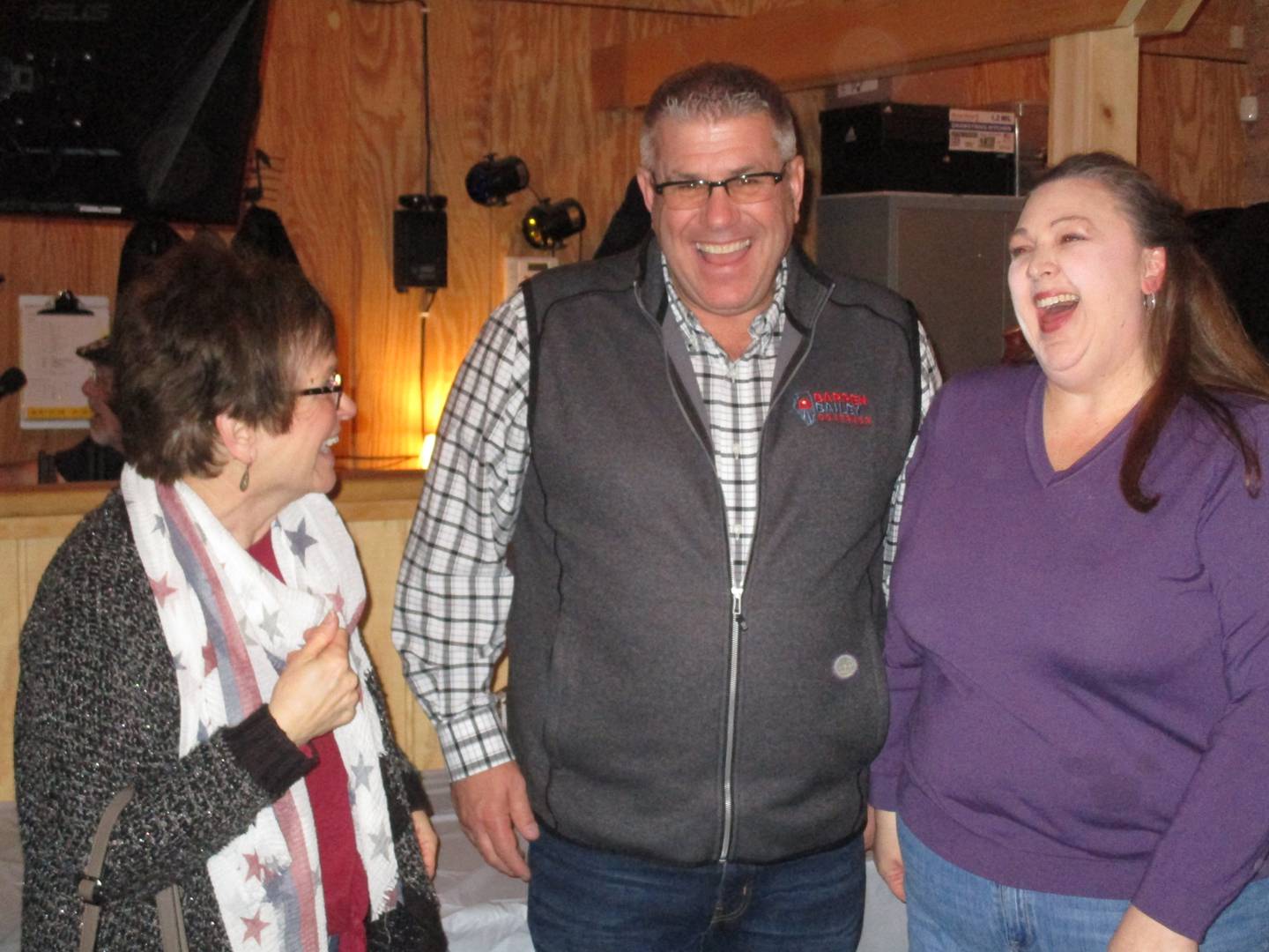 Republican gubernatorial candidate Darren Bailey, an Illinois state senator, shares a laugh with Diana Ashley of Boulder Hill, left, and Natalie Smith of Montgomery, right, during an election rally on March 3, 2022 in Plano. (Mark Foster -- mfoster@shawmedia.com)