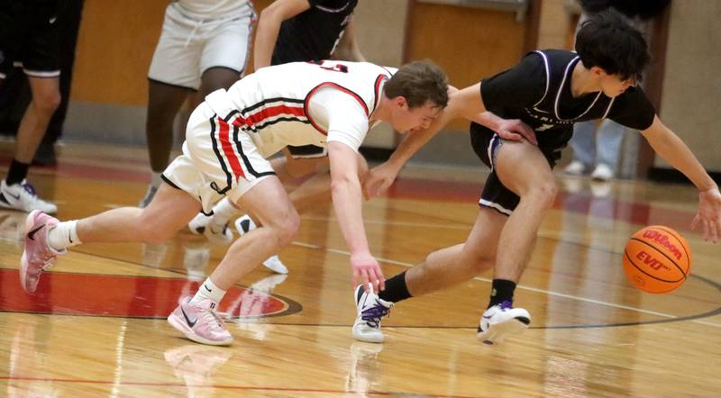 Huntley’s Aidan Gibbs, left, races Hampshire’s Bradley Boyd for the ball in varsity boys basketball on Friday, Dec. 19, 2025, at Huntley High School in Huntley.
