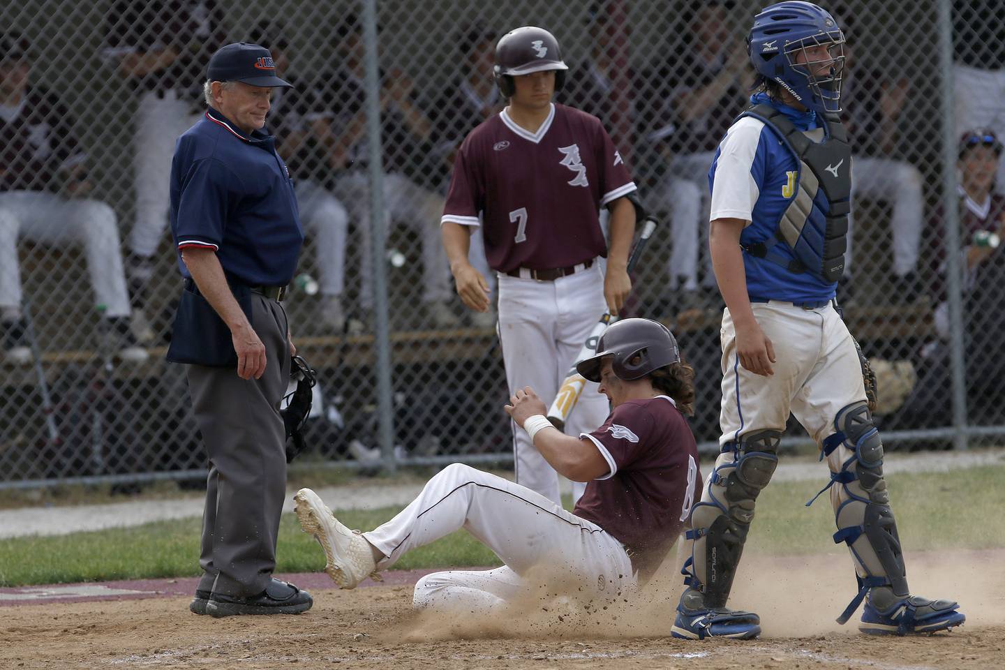 Richmond-Burton's Brock Wood slides into homeplate for a run against Johnsburg during their regional championship baseball game on Monday, June 7, 2021 in Richmond.  Richmond-Burton won 14-4 through 5 innings after a line drive basehit by Jason Miller with two outs and the bases loaded.