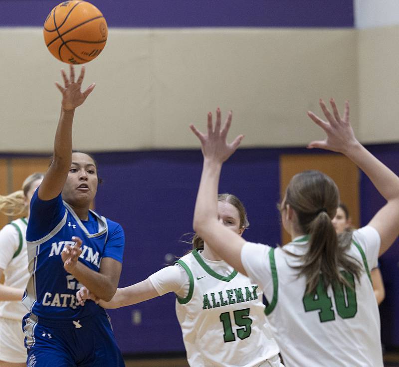 Newman’s Gisselle Martin makes a pass against Alleman Friday, Dec. 26, 2025, at the Duchesses Basketball Christmas Classic.