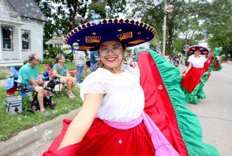 A dancer from Academia de Danza Azatlan participates as the Fiesta Days Parade makes its way down Main Street in McHenry on Sunday, July 20, 2025.