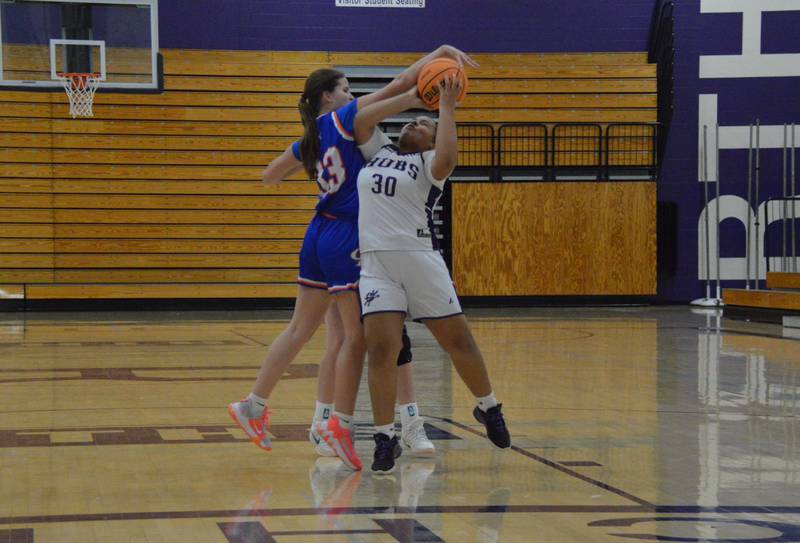 Rochelle's Elizabeth Garland gets fouled putting up a shot during a freshman game with Genoa-Kingston. Rochelle won 49-34.