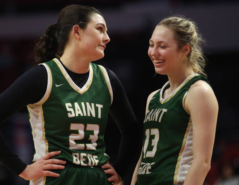 St. Bede's Ali Bosnich and teammate Ashlyn Ehm share a laugh during the Class 1A third-place game on Thursday, Feb. 29, 2024 at CEFCU Arena in Normal.