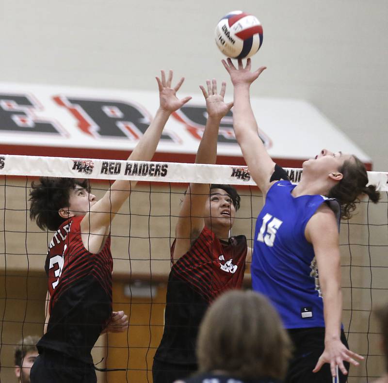 Huntley's Diyas Seitov and Huntley's Edrienn Bautista trie to block the ball of St. Charles North's John Jakaitis during a nonconference boys volleyball match Monday, May 8, 2023, at Huntley High School.