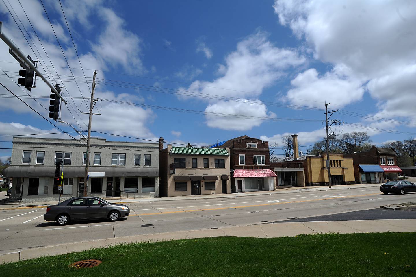 A three-story building with retail space and 80 apartments plus indoor and outdoor parking has been proposed to replace these buildings on Route 14 between Lincoln Avenue and Illinois Street in Fox River Grove.