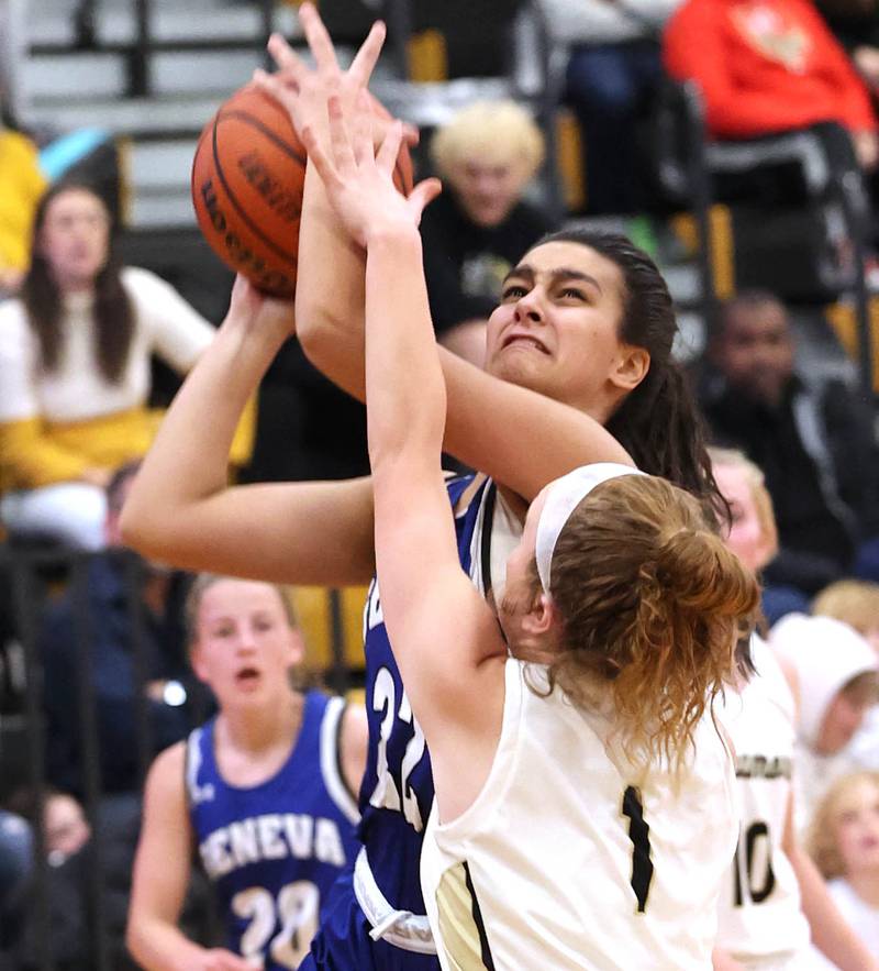 Geneva's Leah Palmer scores over Sycamore's Mallory Armstrong during their game Monday, Nov. 14, 2022, at Sycamore High School.