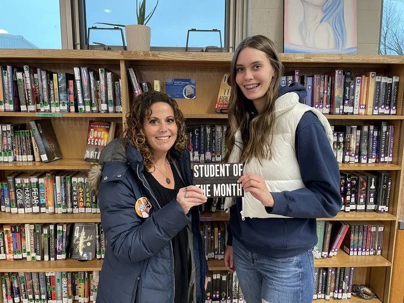 Polo Foundation member Alissa Zeigler presenting the monthly student award to Lindee Poper.