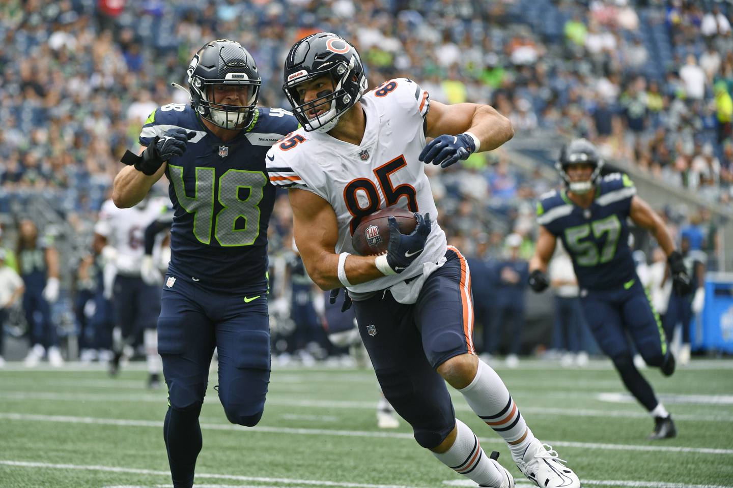 Chicago Bears tight end Cole Kmet tries to avoid a tackle by Seattle Seahawks linebacker Joel Dublanko during the first half Thursday, Aug. 18, 2022, in Seattle.