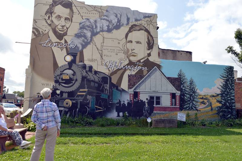 Rita Jacks looks at a mural in Louise A. Quick Park on July 29, 2024. A dedication ceremony took place Monday afternoon.