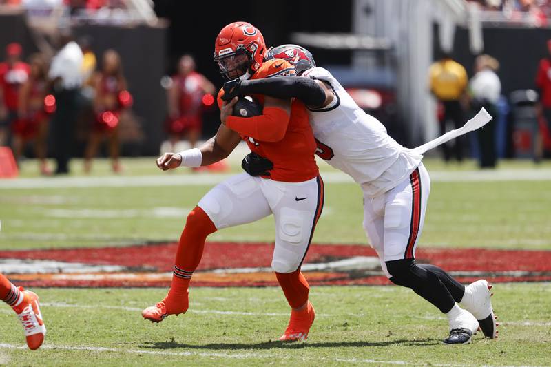 Chicago Bears quarterback Justin Fields is tackled by Tampa Bay Buccaneers linebacker Joe Tryon-Shoyinka during the first half, Sunday, Sept. 17, 2023, in Tampa, Fla.