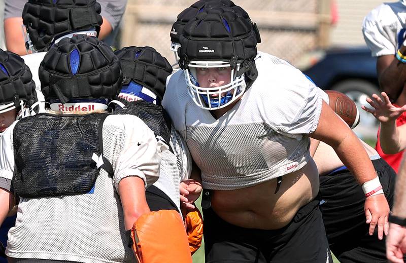 Genoa-Kingston's Colton Hinds prepares to make a block Wednesday, Aug.10, 2022, during practice at the school in Genoa.