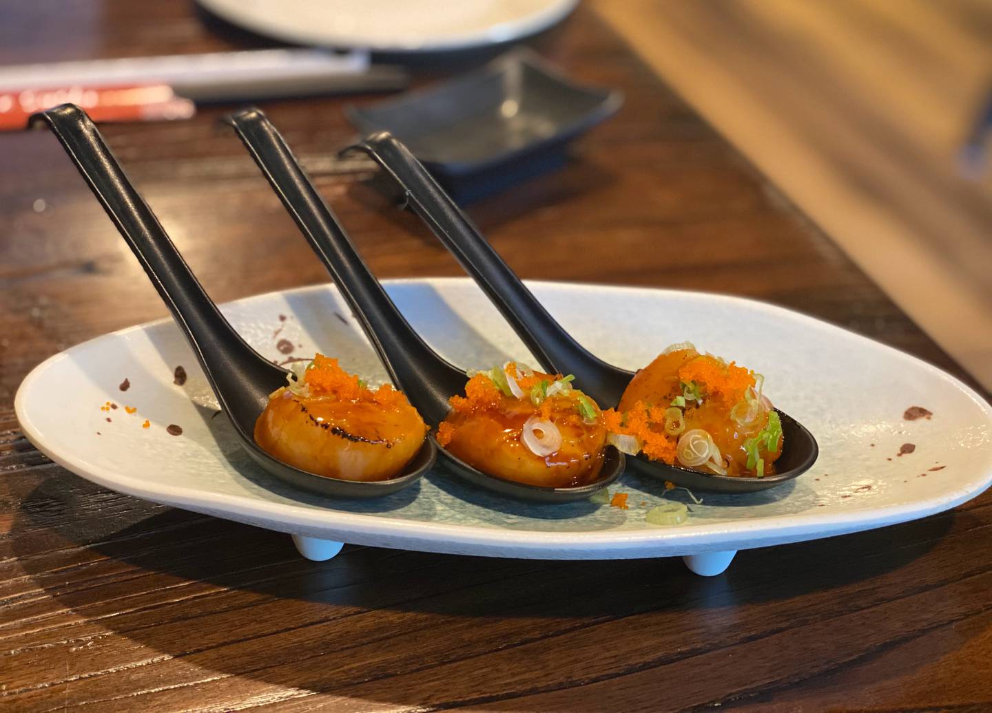 We ordered seared scallops with sesame oil, spicy mayo, eel sauce, scallions and masago as an appetizer at Susie Sushi in Fox River Grove.