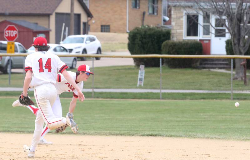 Streator's Zander McCloskey and Blaize Bressner miss a ground ball that goes up the middle against Hall on Wednesday, March 13, 2024 at Kirby Park in Spring Valley.