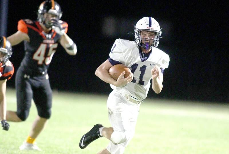 Cary-Grove’s Peyton Seaburg runs the ball in varsity football at Metcalf Field in Crystal Lake Friday night.