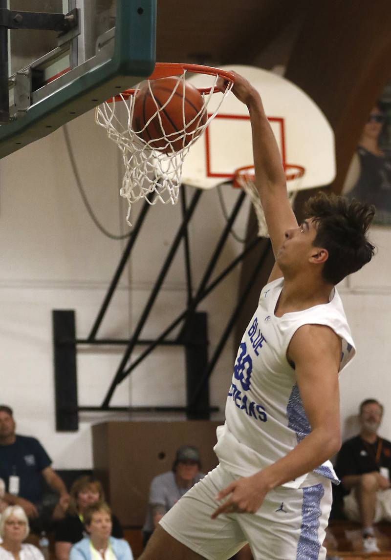 Woodstock's Spencer Cullum dunks the basketball during the dunk contest of McHenry County Area All-Star Basketball Extravaganza on Sunday, April 14, 2024, at Alden-Hebron’s Tigard Gymnasium in Hebron.