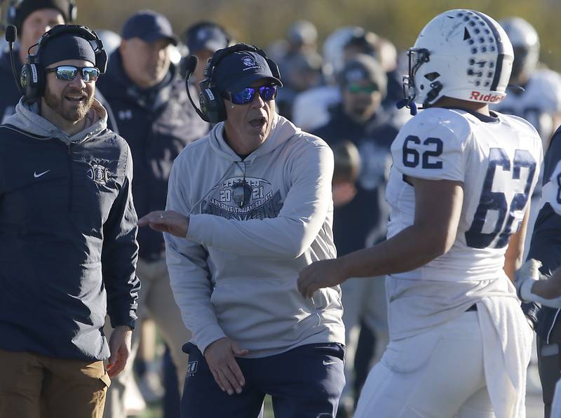 Cary-Grove Head Coach Brad Seaburg celebrates a touchdown with Samuel Diaz during a IHSA Class 6A semifinal playoff football game against Lake Zurich on Saturday, Nov. 18, 2023, at Lake Zurich High School.