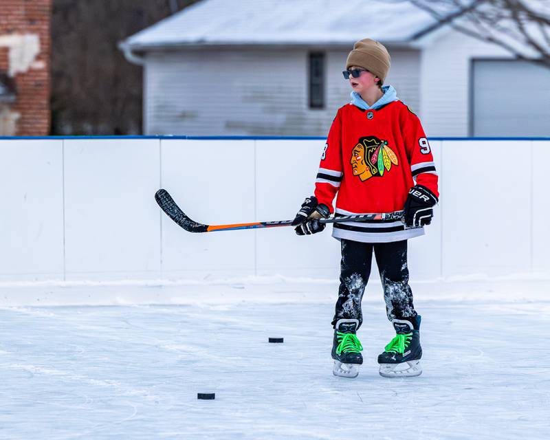 Weston Harris skates with hockey stick at Schweickert Arena's Ice Rink on Tuesday, December 30, 2025, at Washington Park in Peru.