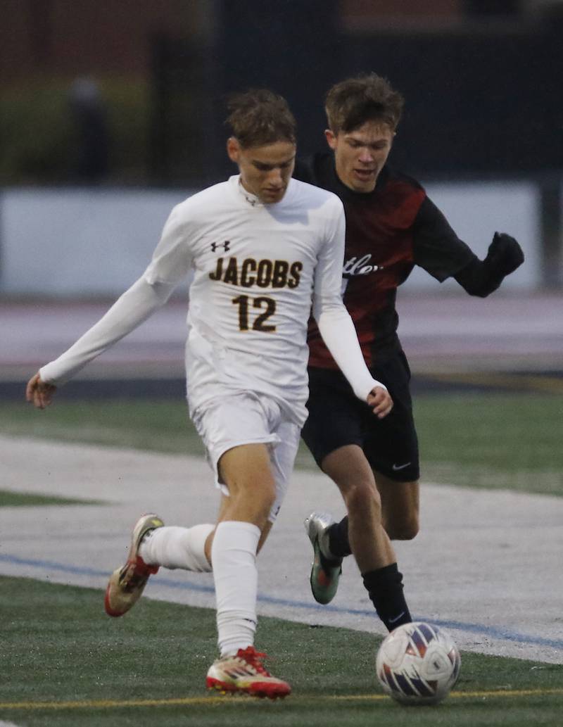 Jacobs' David Kuklo tries to control the ball in front of Huntley's Brendan Freier during an IHSA Class 3A Huntley Regional boys soccer semifinal match on Tuesday, Oct. 21, 2025, at Huntley High School.