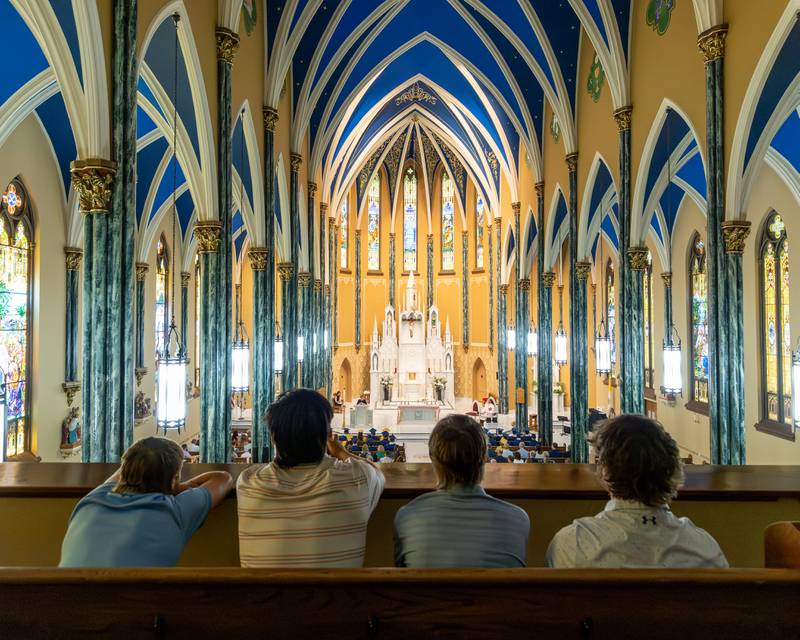 Current Marquette Academy Students watch from the balcony of St. Columba Church as their peers are recognized at the 2026 Graduation Ceremony on May 24, 2026 at St. Columba Church in Ottawa.