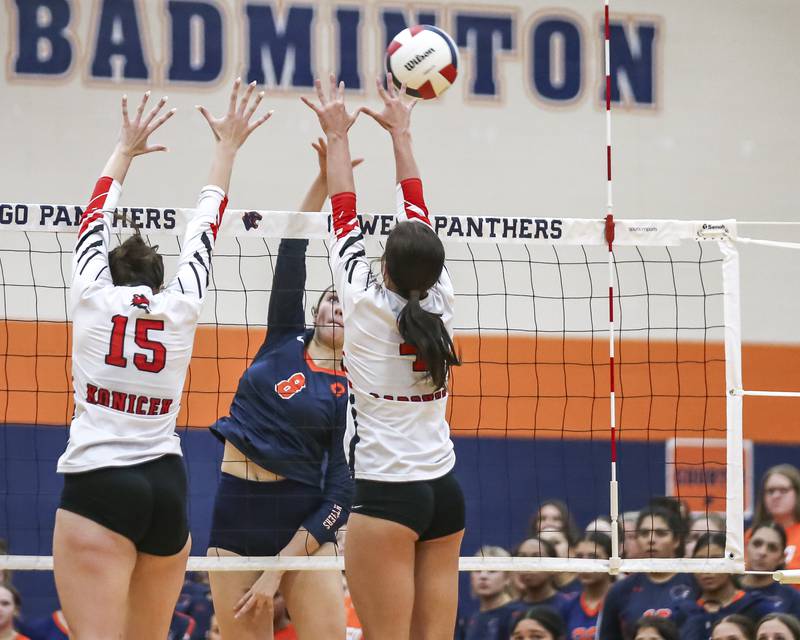 Oswego's Sara Gilio (8) with a kill past the Yorkville defense during volleyball match between Yorkville at Oswego. Sept 23, 2025.