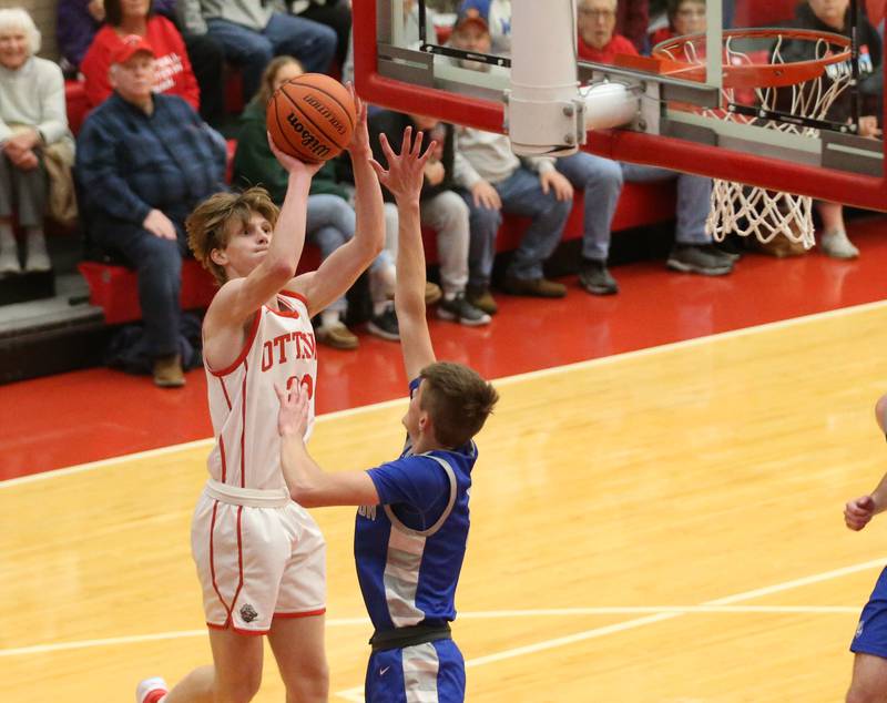 Ottawa's Aric Thredgill pulls up in the lane to shoot a shot over Princeton's Landen Koning during the Dean Riley Shootin' The Rock Thanksgiving Tournament on Monday, Nov. 20, 2023 at Kingman Gym.