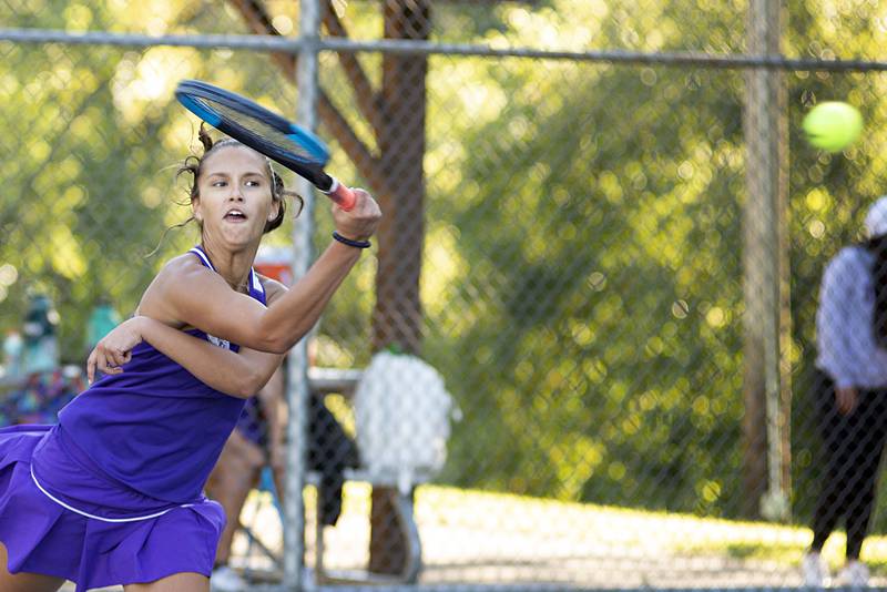 Dixon’s Addison Arjes returns a shot against Sterling’s Ellie Aitken Thursday, Sept. 29, 2022.