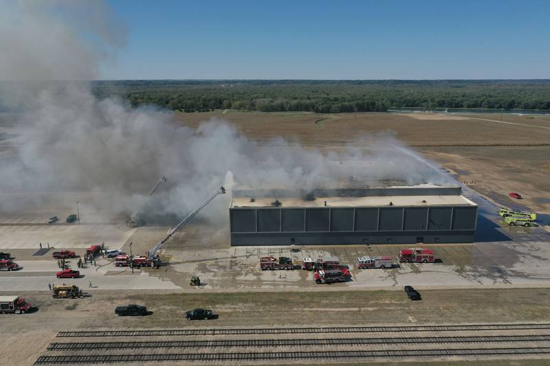 Smoke billows from Marquis Energy as firefighters work to control a structure fire on Wednesday, Oct. 8, 2025 in Hennepin. The fire was upgraded to a 5th alarm dispatching the (MABAS) Mutual Aid Box Alarm System. The fire broke out around 11a.m.