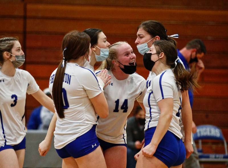 Katie Bates (14) and Princeton teammates get excited over scoring a point Thursday night against St. Bede.