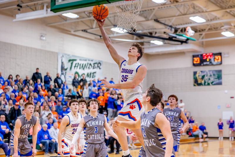 Eastland junior Parker Krogman goes up for a layup against Newman defenders during the Class 1A Regional championship at West Carroll on Friday, February 28, 2025.