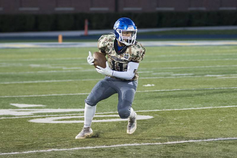 Newman’s Gabe Padilla runs for yards after making a catch against St. Bede Friday, Sept. 16, 2022.