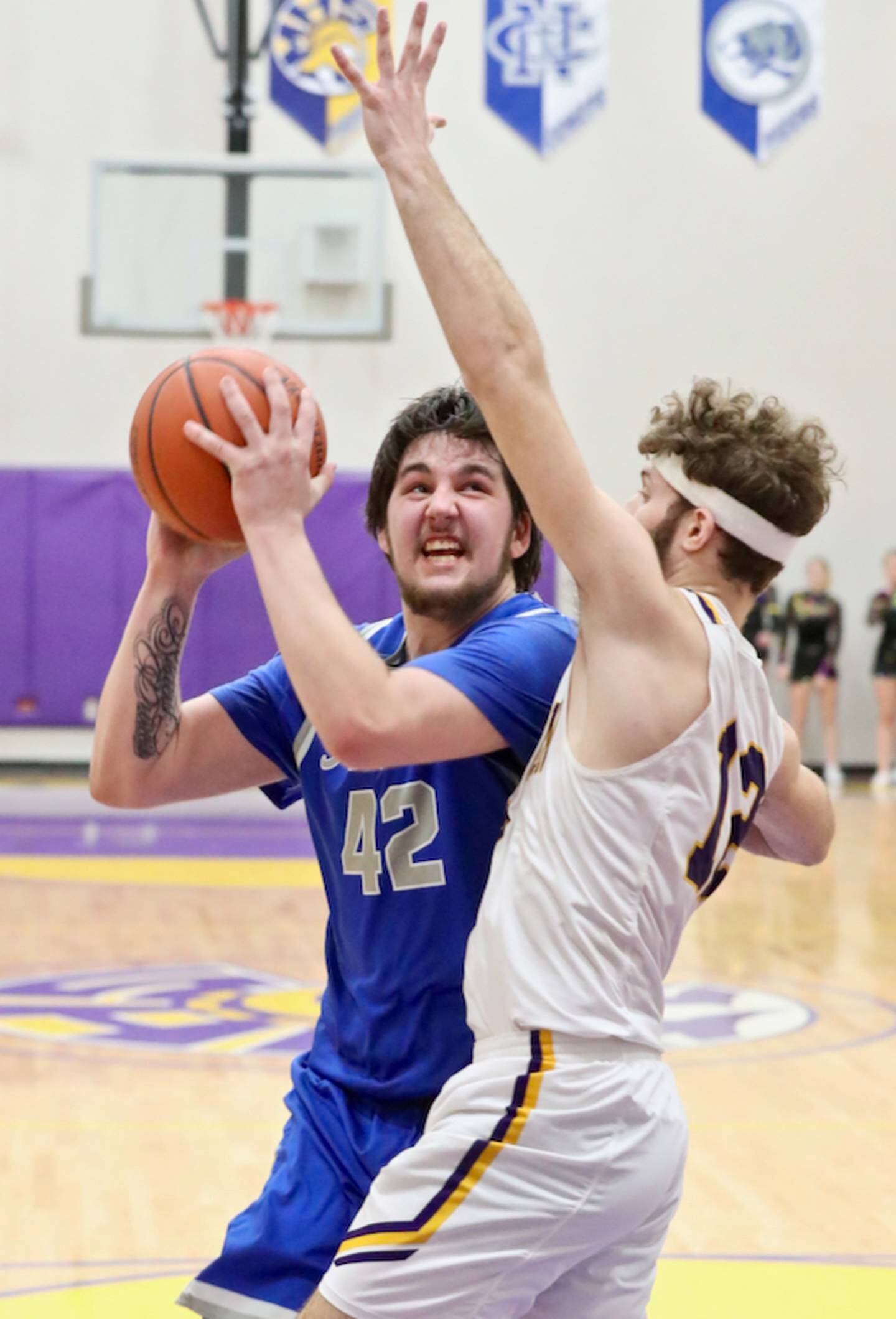 Princeton's Kaden Monroe eyes the basket against Farmington's Ethan Evans at the Mendota Sectional Tuesday night. The Farmers won 65-56.