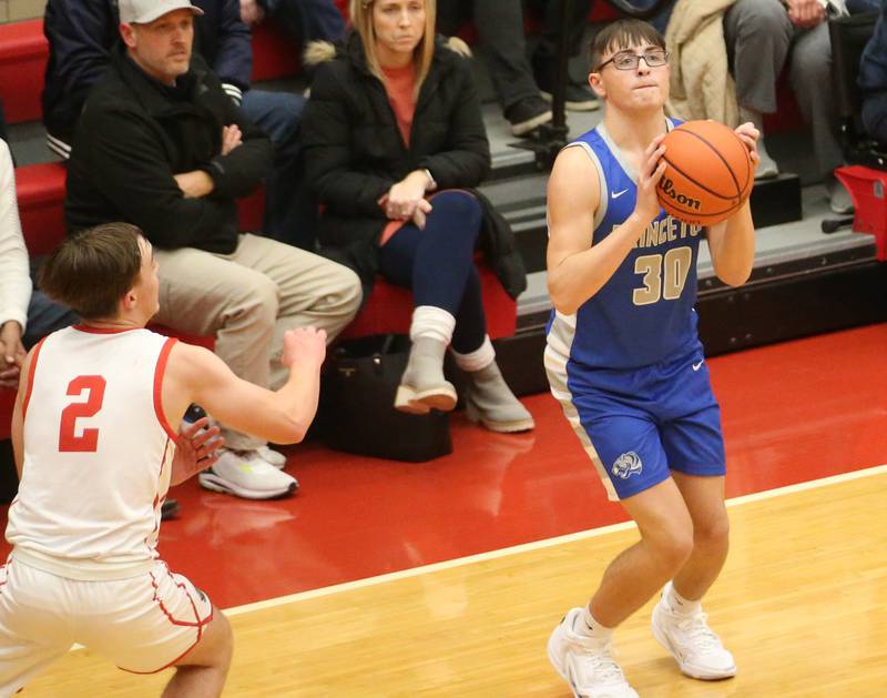 Princeton's Sean Maynard looks to shoot while Ottawa's Huston Hart races to defend during the Dean Riley Shootin' The Rock Thanksgiving Tournament on Monday, Nov. 20, 2023 at Kingman Gym.