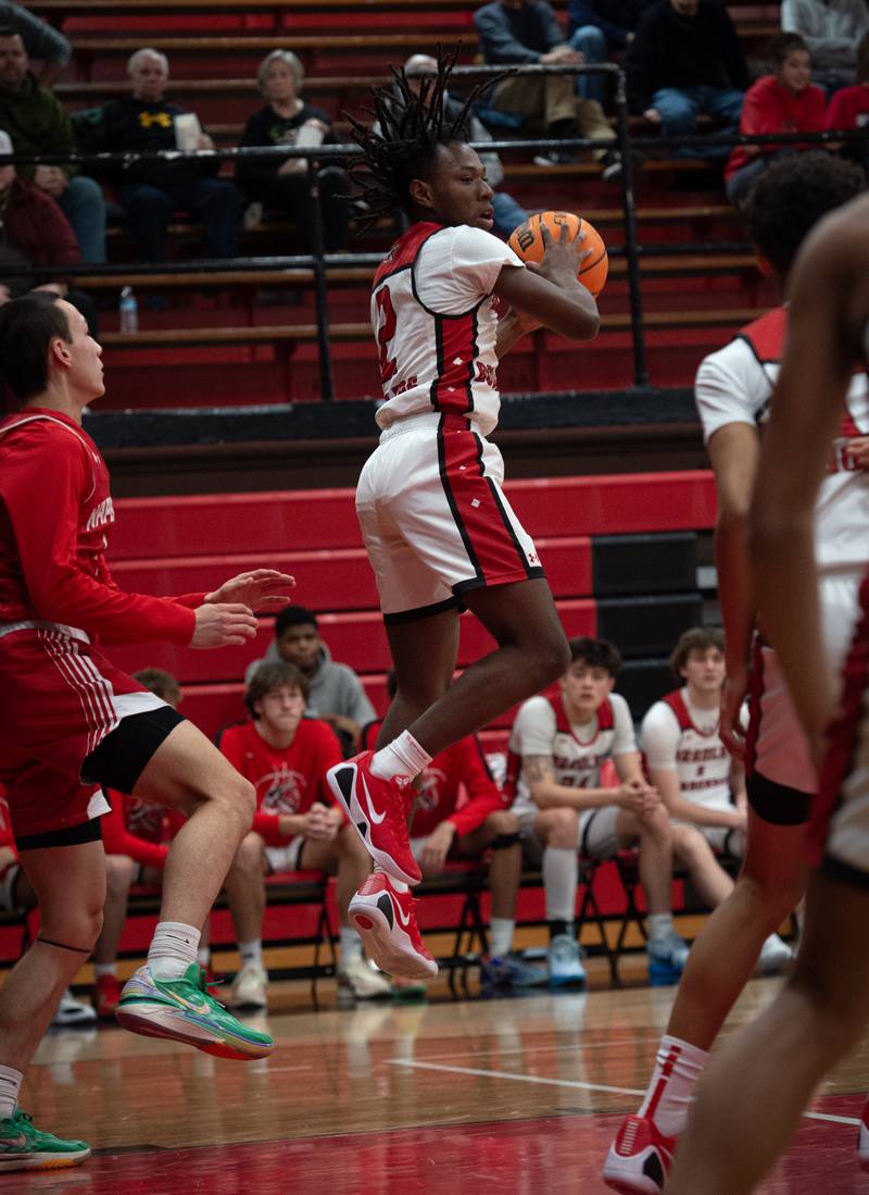 Bradley-Bourbonnais's Kobe Lawrence brings in a rebound in a game against Naperville Central on Monday, December 15, 2025.