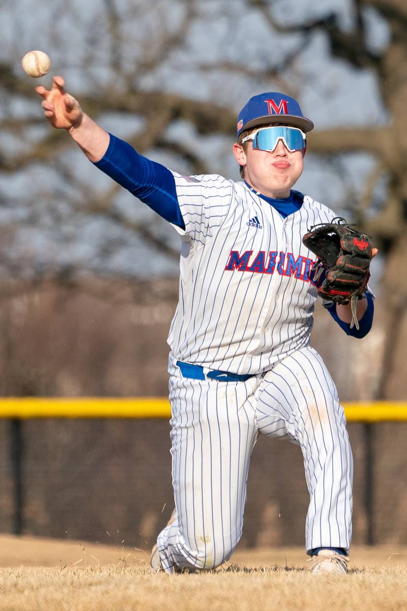 Marmion’s Ethan Flores (28) fields a grounder and throws to first for an out against Yorkville during a baseball game at Marmion High School in Aurora on Tuesday, Mar 28, 2023.