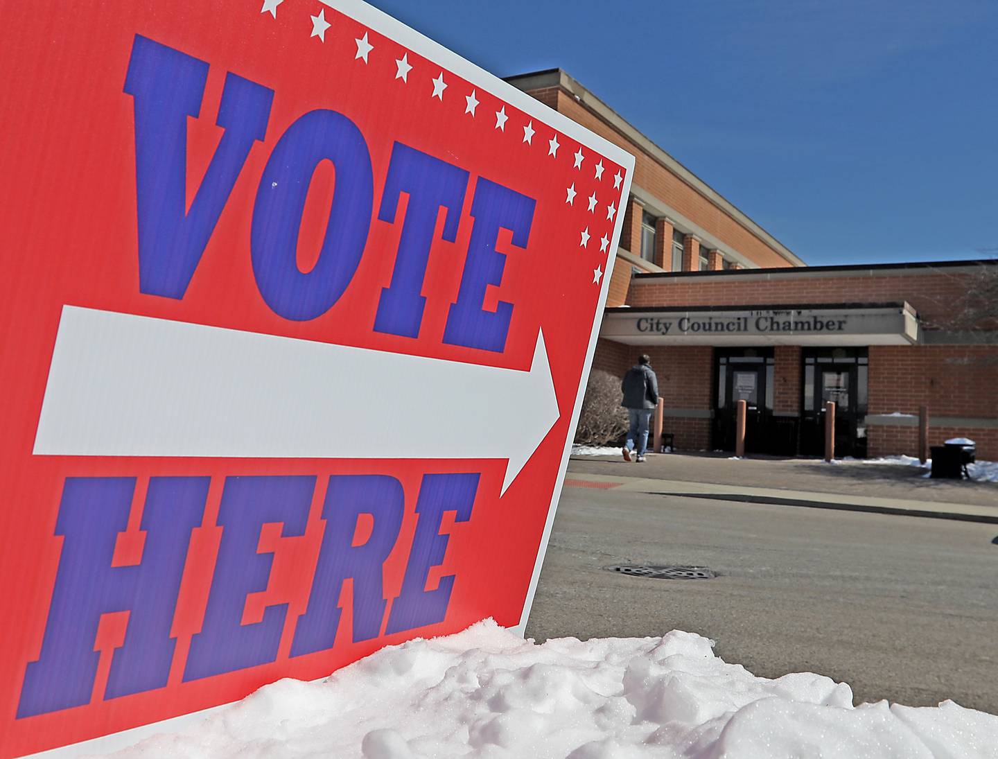 A voter walks into the McHenry City Hall on Tuesday, March, 17, 2026, to cast a ballot in the Illinois primary election.