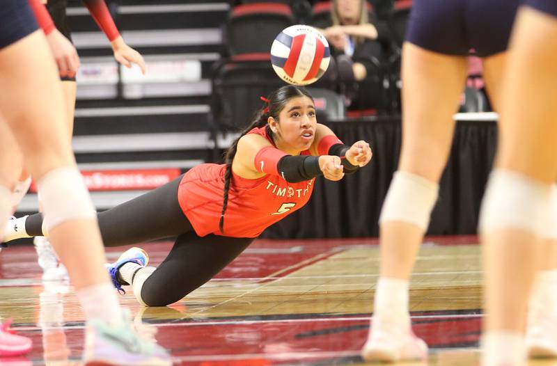 Timothy Christian libero Miriam Pozdol-Niego returns a serve from Bloomington Central Catholic during the Class 2A State semifinal game on Friday, Nov. 15, 2024 at CEFCU Arena in Normal.