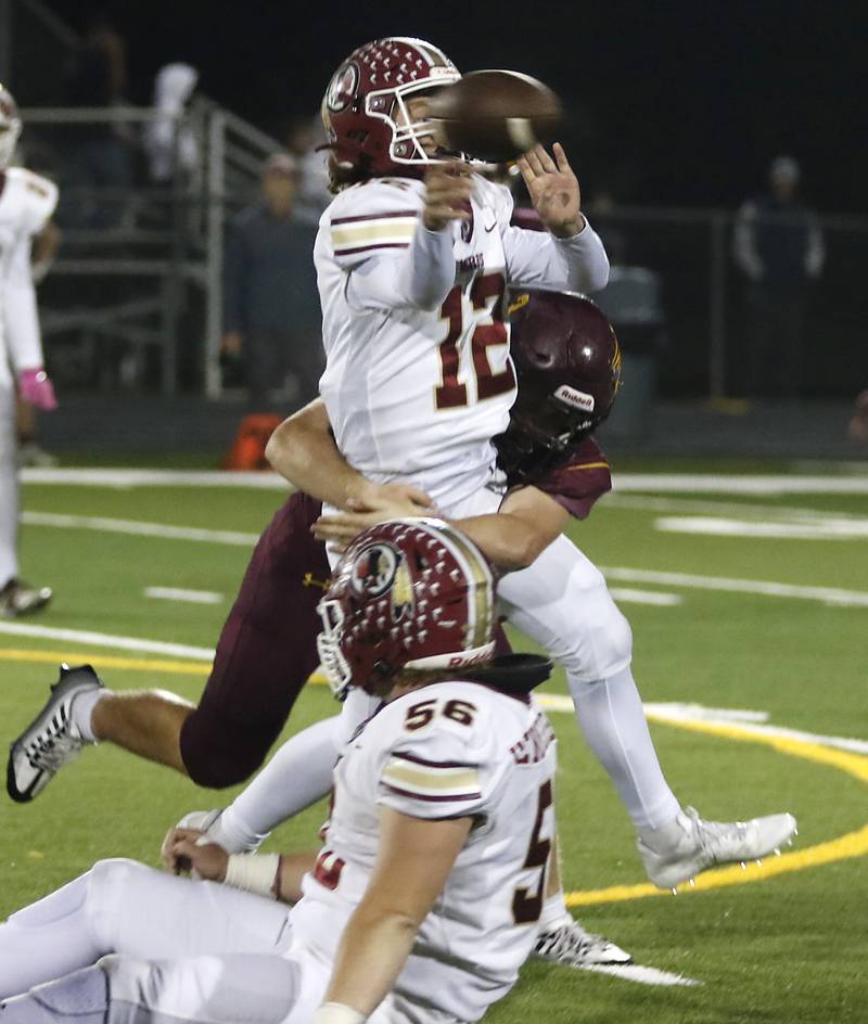 Richmond-Burton's Steven Siegel hits Morris’ Carter Button as he attempt to pass during a Kishwaukee River Conference / Interstate 8 Conference crossover football game Friday, Sept. 30, 2022, between Richmond-Burton and Morris at Richmond-Burton Community High School in Richmond.