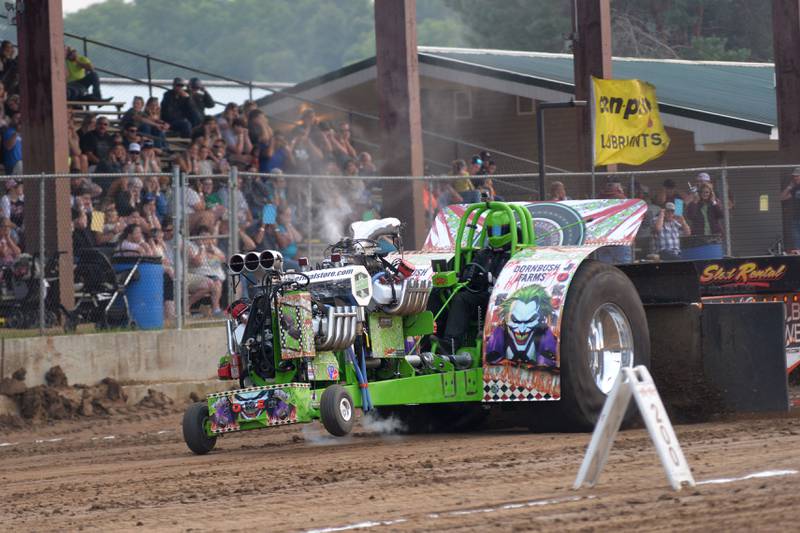 Logan Dornbush of Albany drives his modified tractor "Joker" in the open division of the tractor pull at the Ogle County Fair in Oregon on Thursday, July 31, 2025.