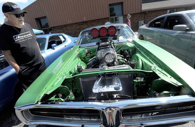 Bill Oeser of Big Rock checks out a 1971 Dodge Charger, owned by Todd Carlson of Aurora at Hometown Days on Sunday, Sept. 1, 2024, at Beecher Park in Yorkville