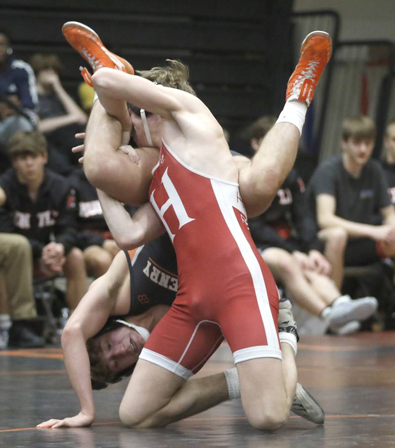Huntley’s Shane McGuine tries to control McHenry’s Pedro Jimenez during the 150-pound match of a Fox Valley Conference boys wrestling match Thursday, Jan. 11, 2024, at McHenry High School.