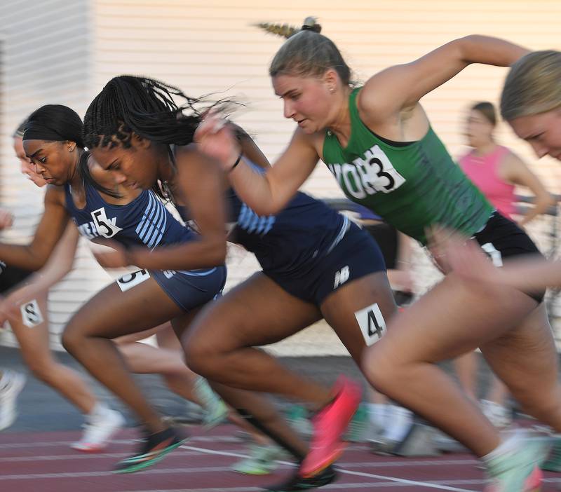Lake Park’s  and Lake Park’s Imani Ogunribido, 5, and teammate Sereana Vulaono, 4, race with York’s Elaine Paul out of the blocks in the 100-meter dash in the Class 3A Rolling Meadows girls tracking field sectional meet on Wednesday, May 10, 2023.