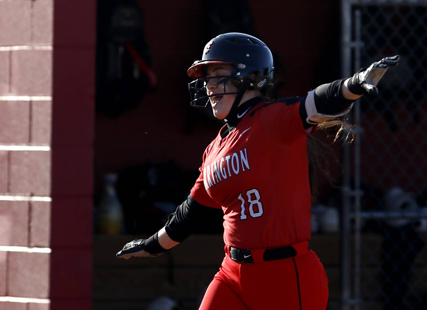 Barrington’s Emma Kavanagh celebrates her home run that hit the score board during a non-conference softball game Friday, April 1, 2022, between McHenry and Barrington at Barrington High School.