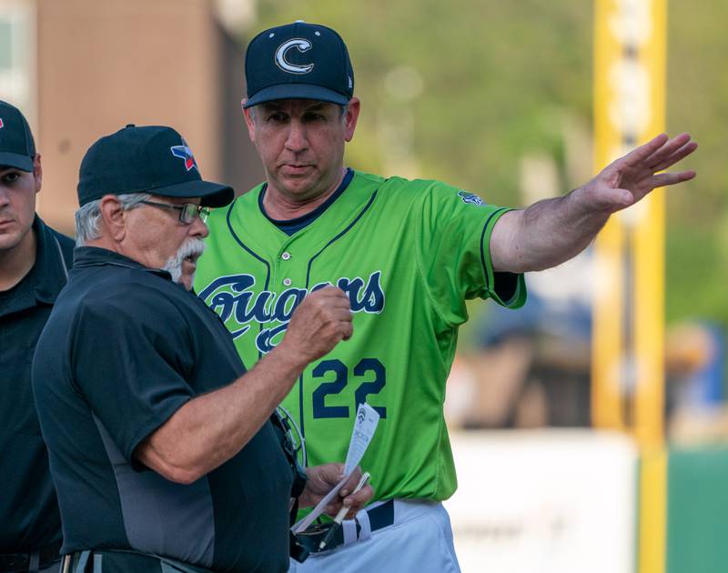 Sean King for the Daily Herald
Kane County Cougars manager George Tsamis (22) talks to home plat Umpire Trent Delimont prior to the start of a baseball game at Northwestern Medicine Field in Geneva on Friday, May 13, 2022.
