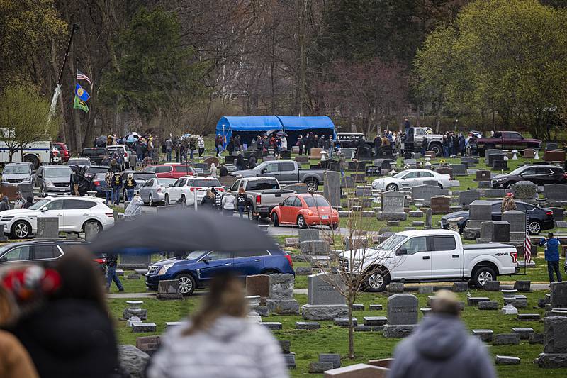 Mourners file to the gravesite of Jayden Hanson Thursday, April 4, 2024 at Riverside Cemetery in Prophetstown.